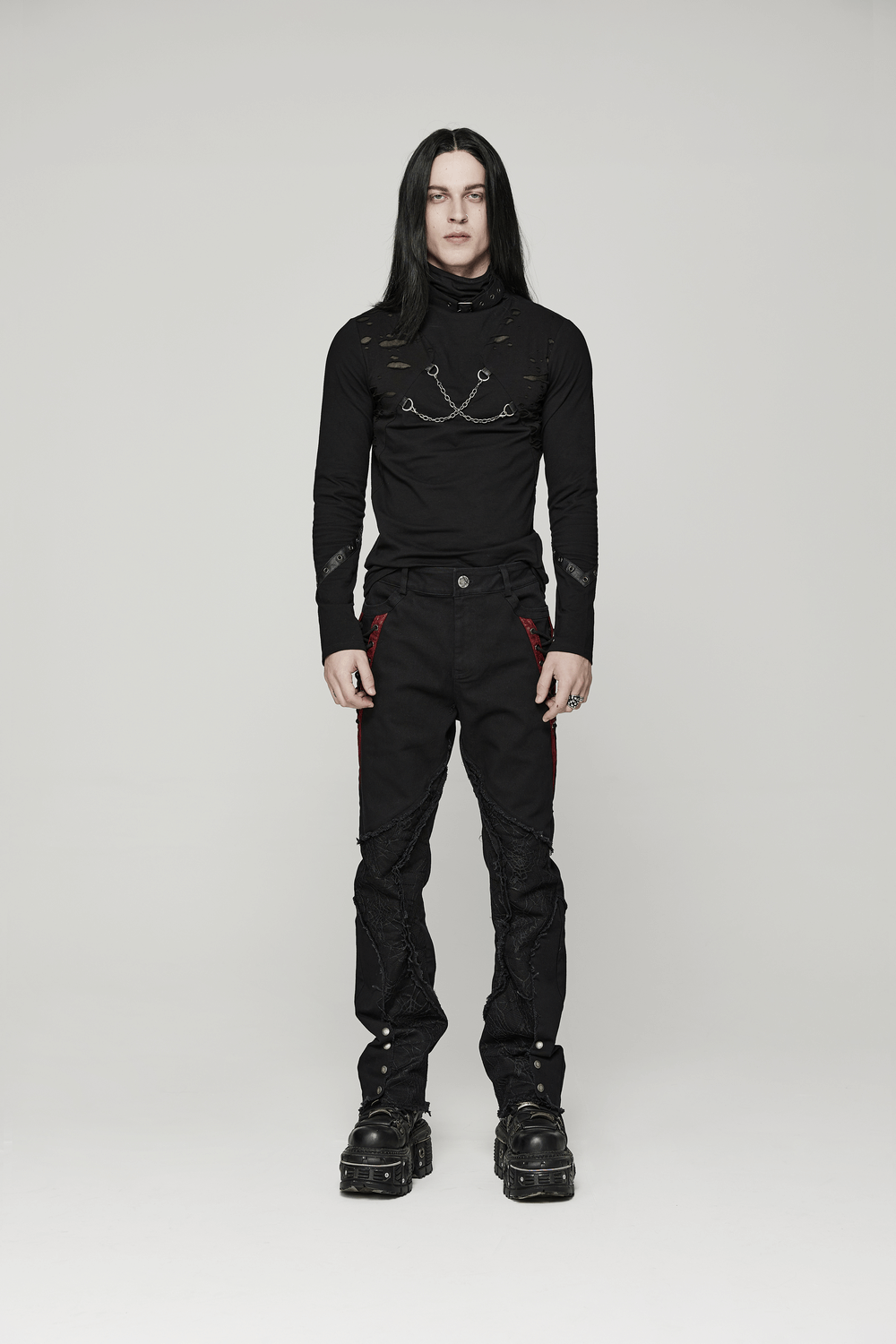 Men's Gothic long sleeve chain top with broken holes, paired with black pants and chunky boots, showcasing punk streetwear style.
