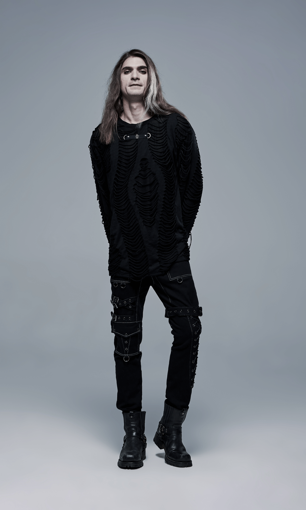 Men's Gothic Buckled Cargo Pants with a stylish black top, showcasing urban punk fashion and striking strap accents.