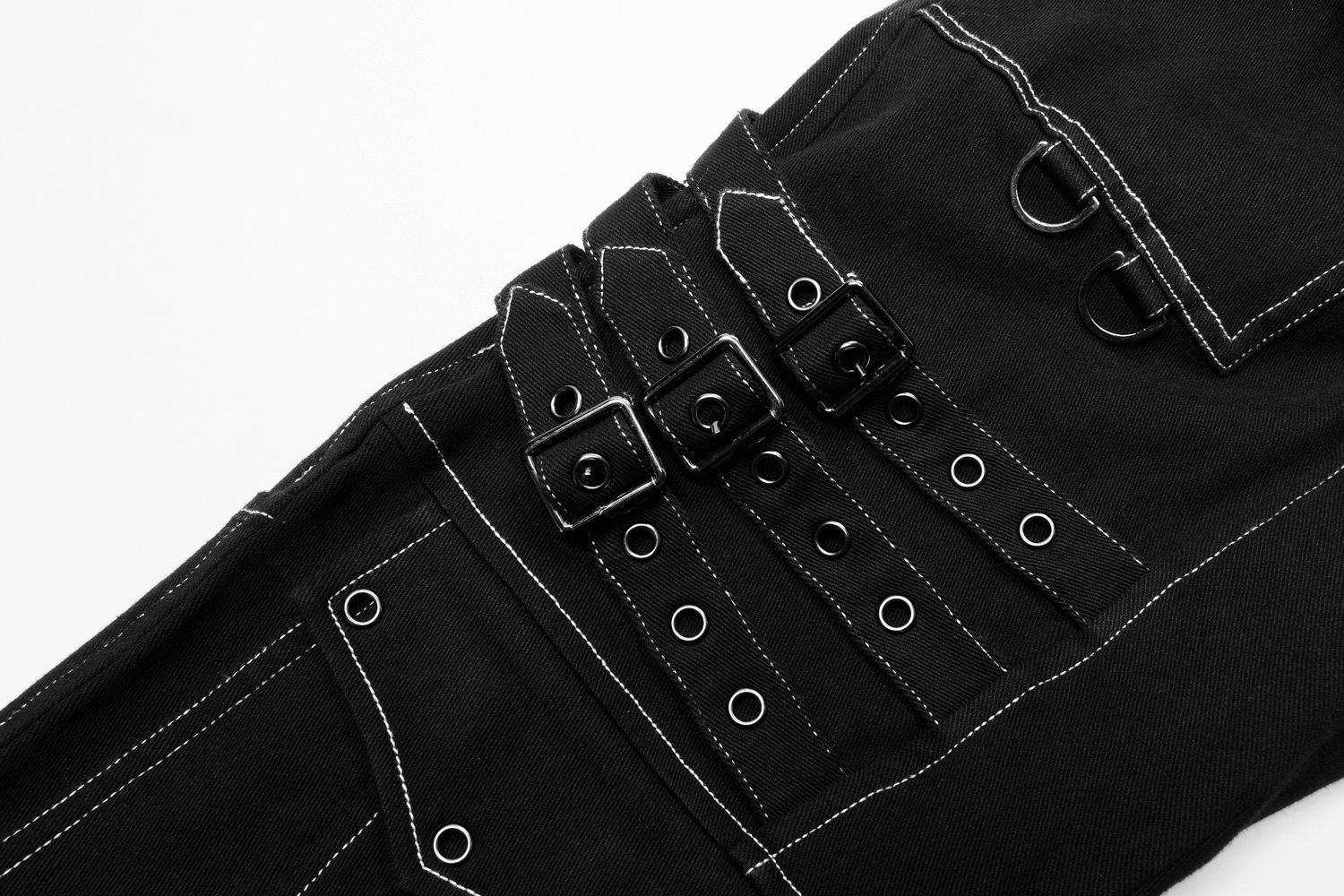 Close-up of men's gothic buckled cargo pants showcasing strap details and contrasting white stitching.