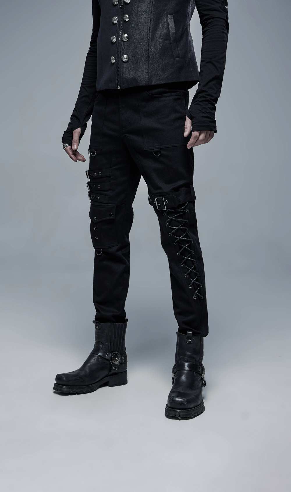 Men's black Gothic cargo pants with buckles and lace-up detail, styled for a bold, edgy punk look.