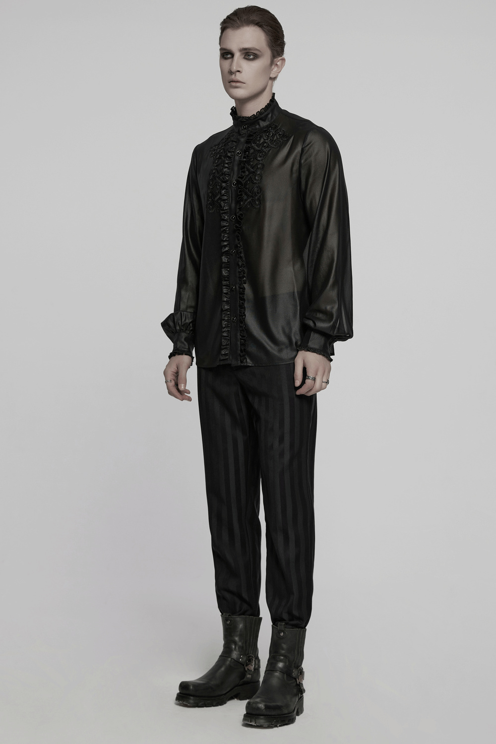 Men's elegant gothic chiffon shirt with ruffles and lace, styled with black trousers and combat boots.