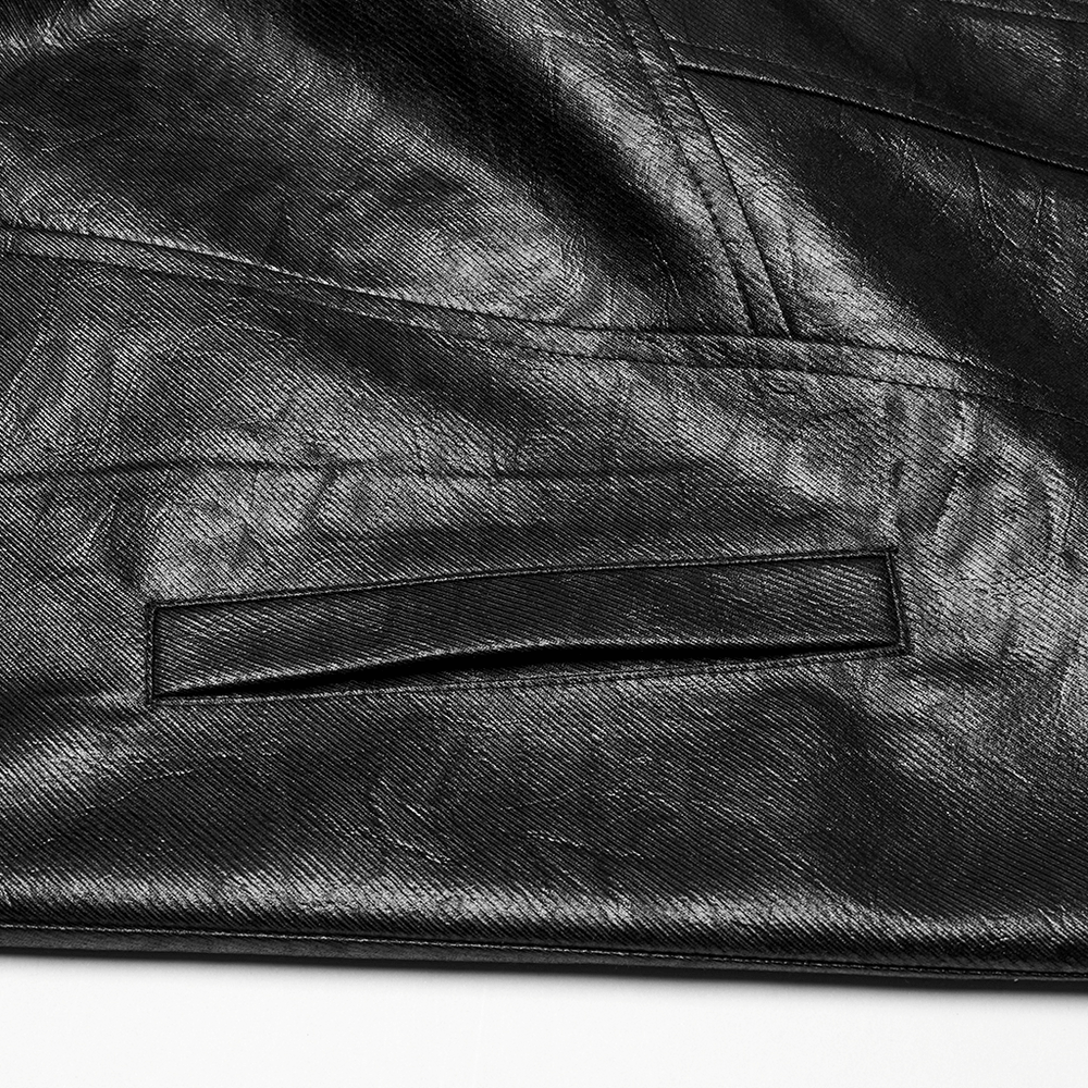 Close-up of the black faux leather texture and detail on a men's cyberpunk trench coat.