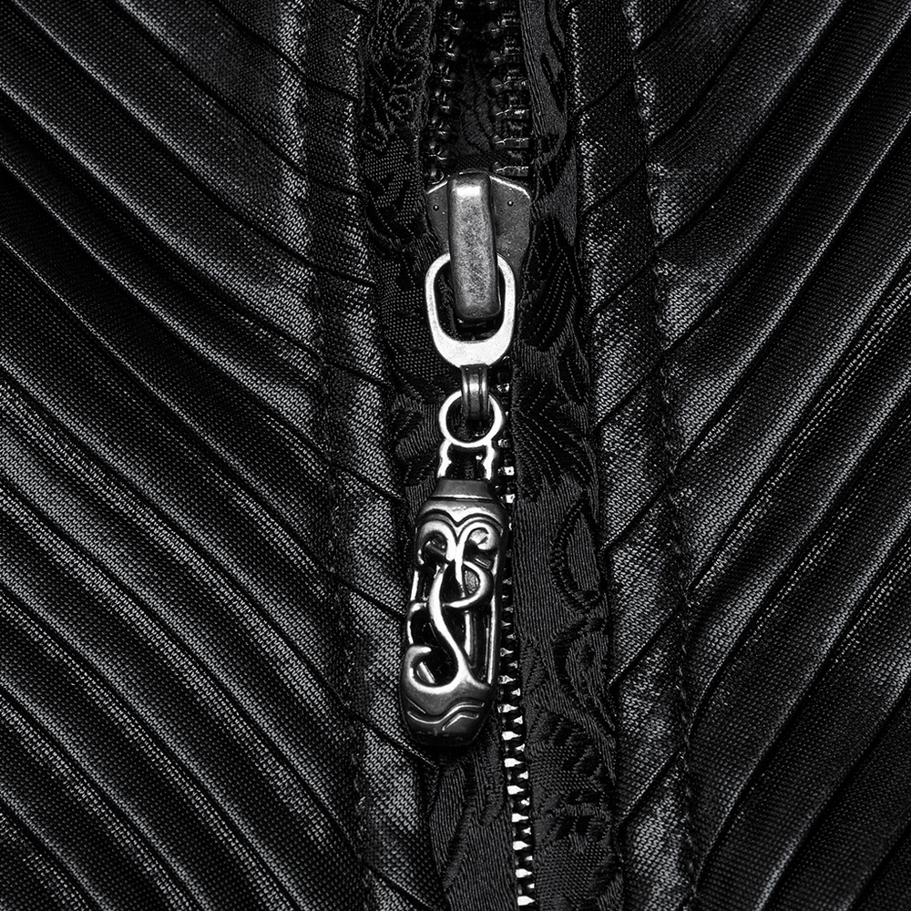 Close-up of a gothic black waistcoat zipper detail with textured pleats and ornate pull tab.