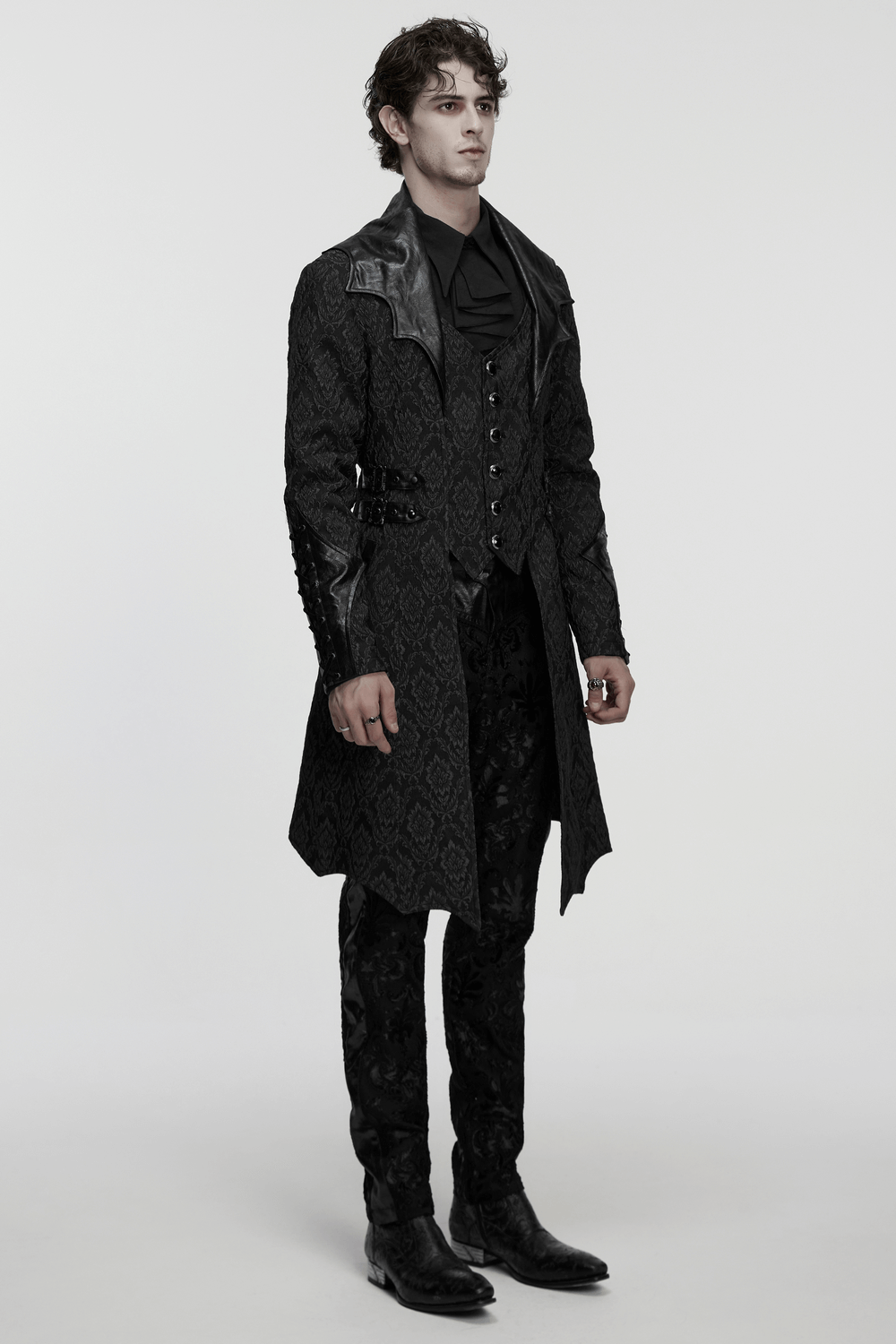 Men's Gothic Jacquard Coat with Bat Lapel and Details worn by model in dramatic pose.
