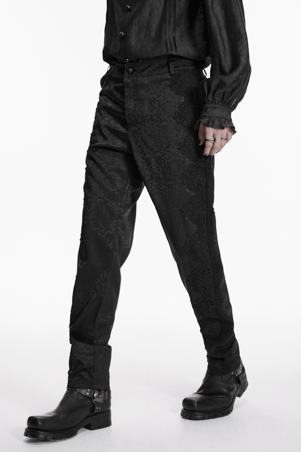 Men's Gothic Jacquard Pants with Baroque Pattern worn with a stylish black shirt and boots.