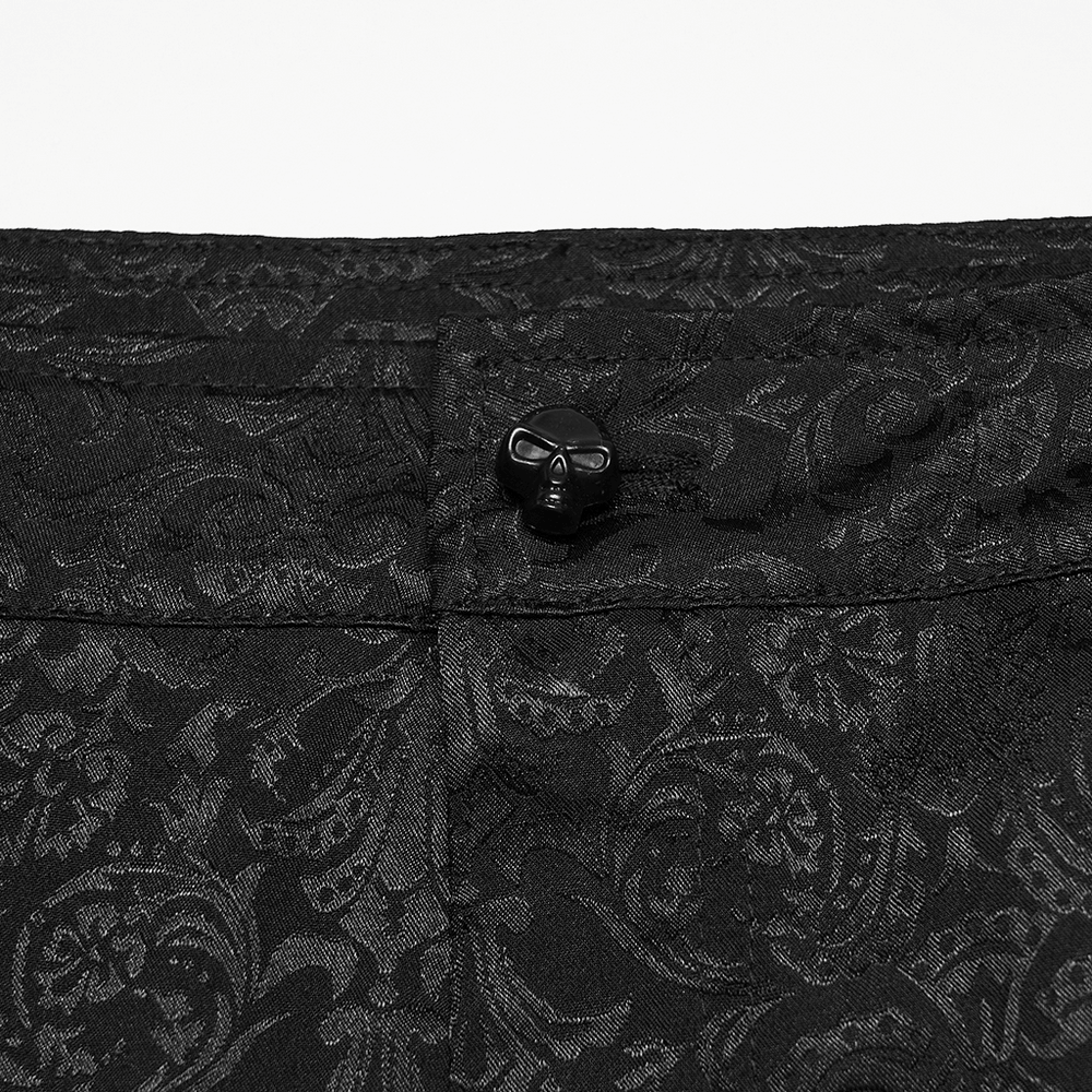 Men's Gothic Jacquard Pants with Baroque Pattern close-up of the waistband detail and skull button embellishment.