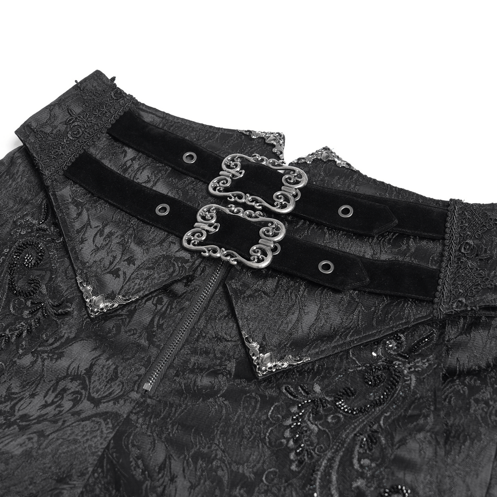 Close-up of men's gothic jacquard pants with double velvet buckles and ornate brocade pattern.