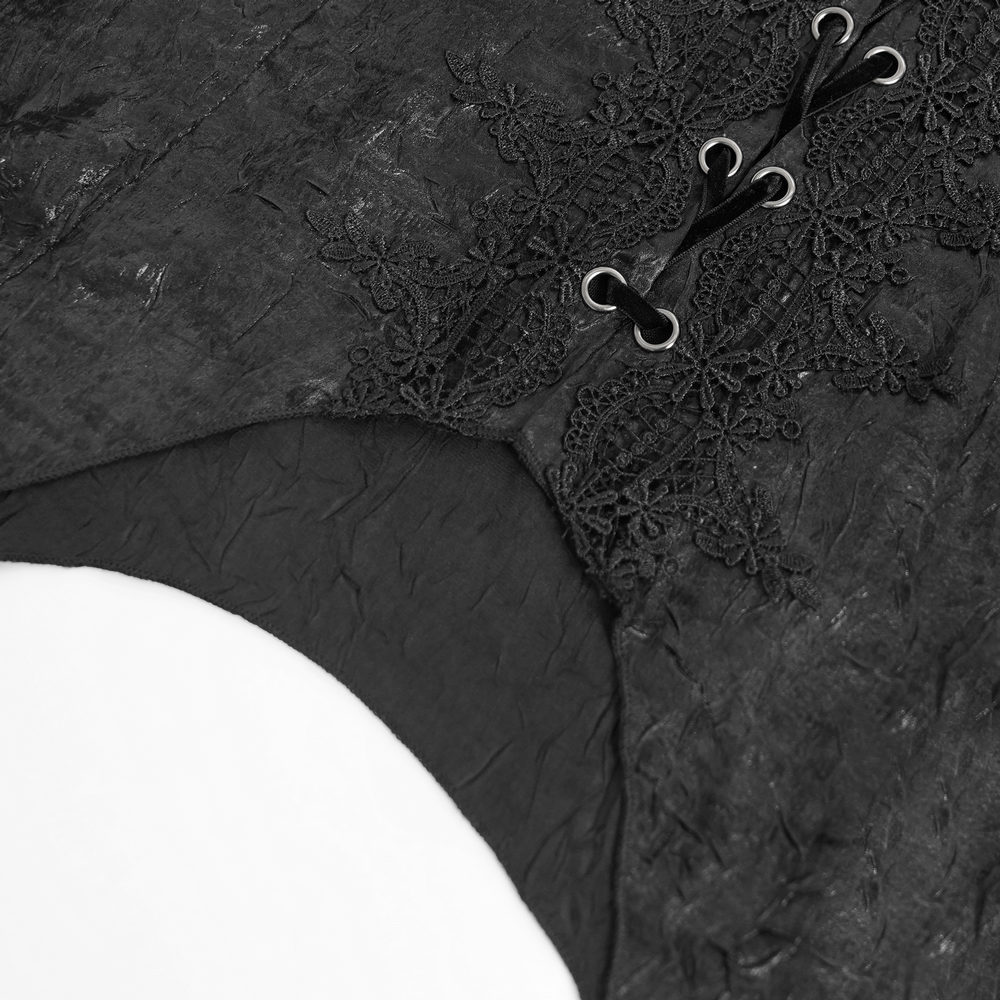 Close-up of a black gothic lace-up shirt with intricate lace detailing and a corset-style back.