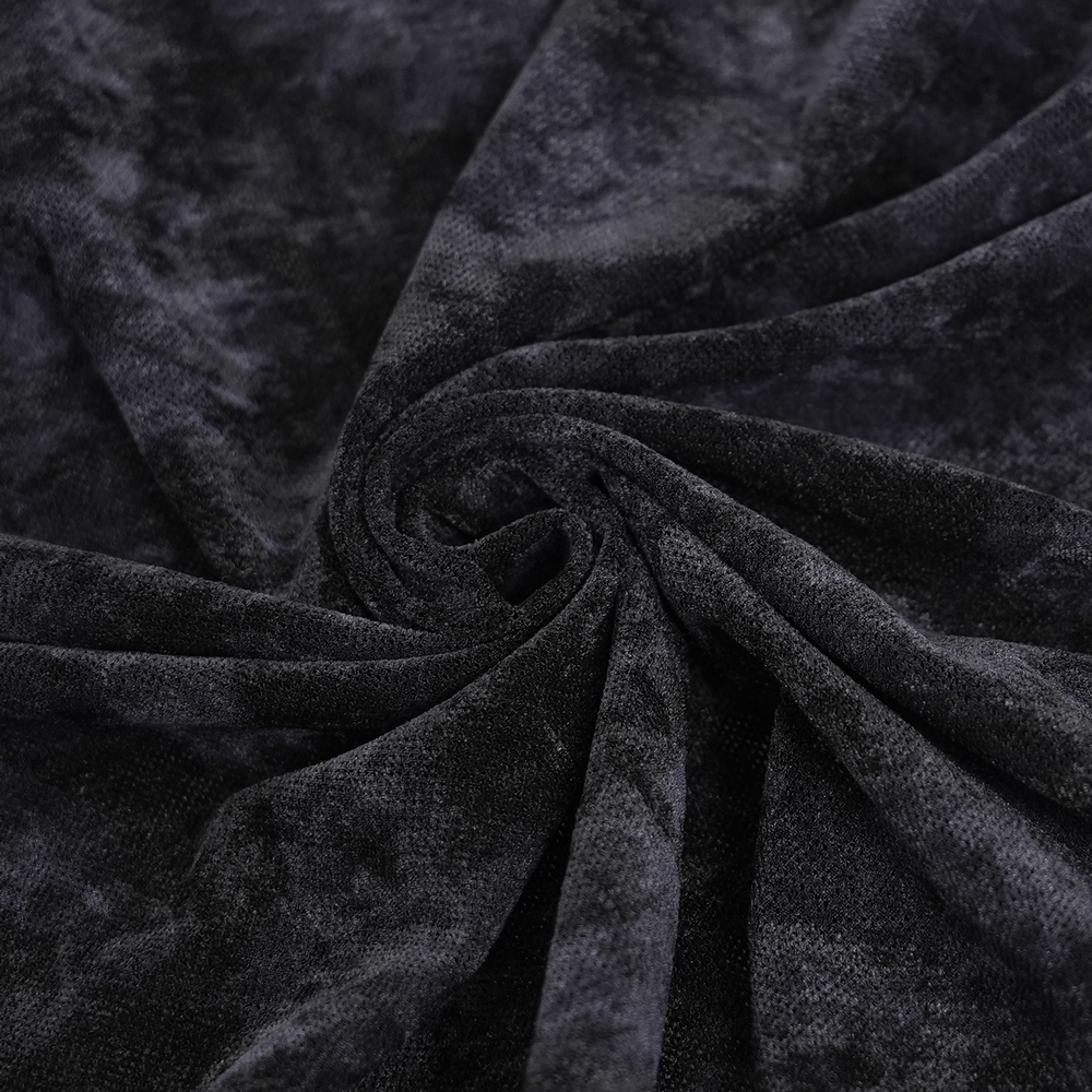 Close-up of soft black fabric highlighting a textured pattern for gothic clothing. Perfect for edgy fashion designs.