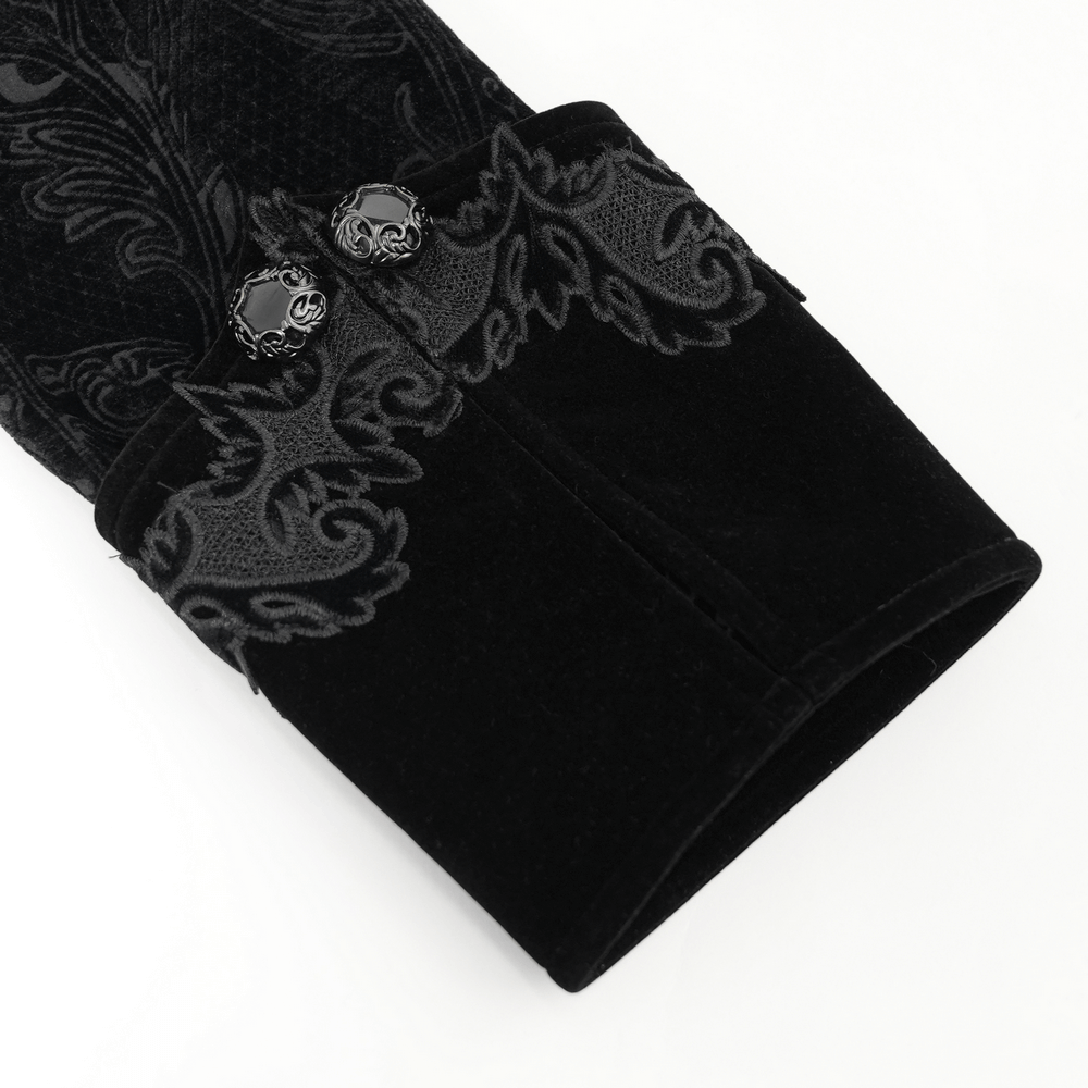 Close-up of the sleeve of a Men's Gothic Long Velvet Coat with brocade trim and unique skull buttons.