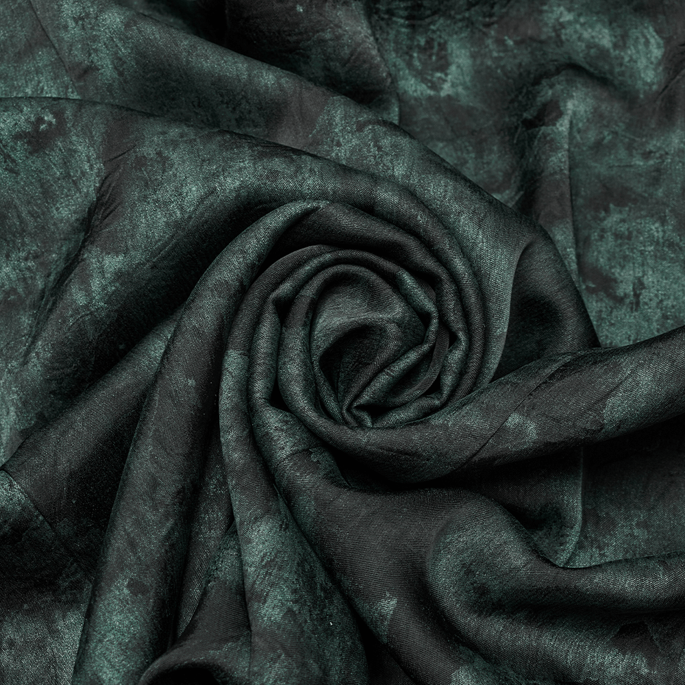 Close-up of textured dark green fabric, ideal for gothic fashion and alternative style apparel.