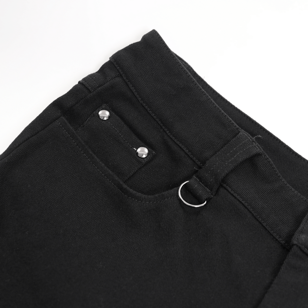 Close-up of black slim fit pants with metal buttons and a decorative loop for a punk rock vibe.