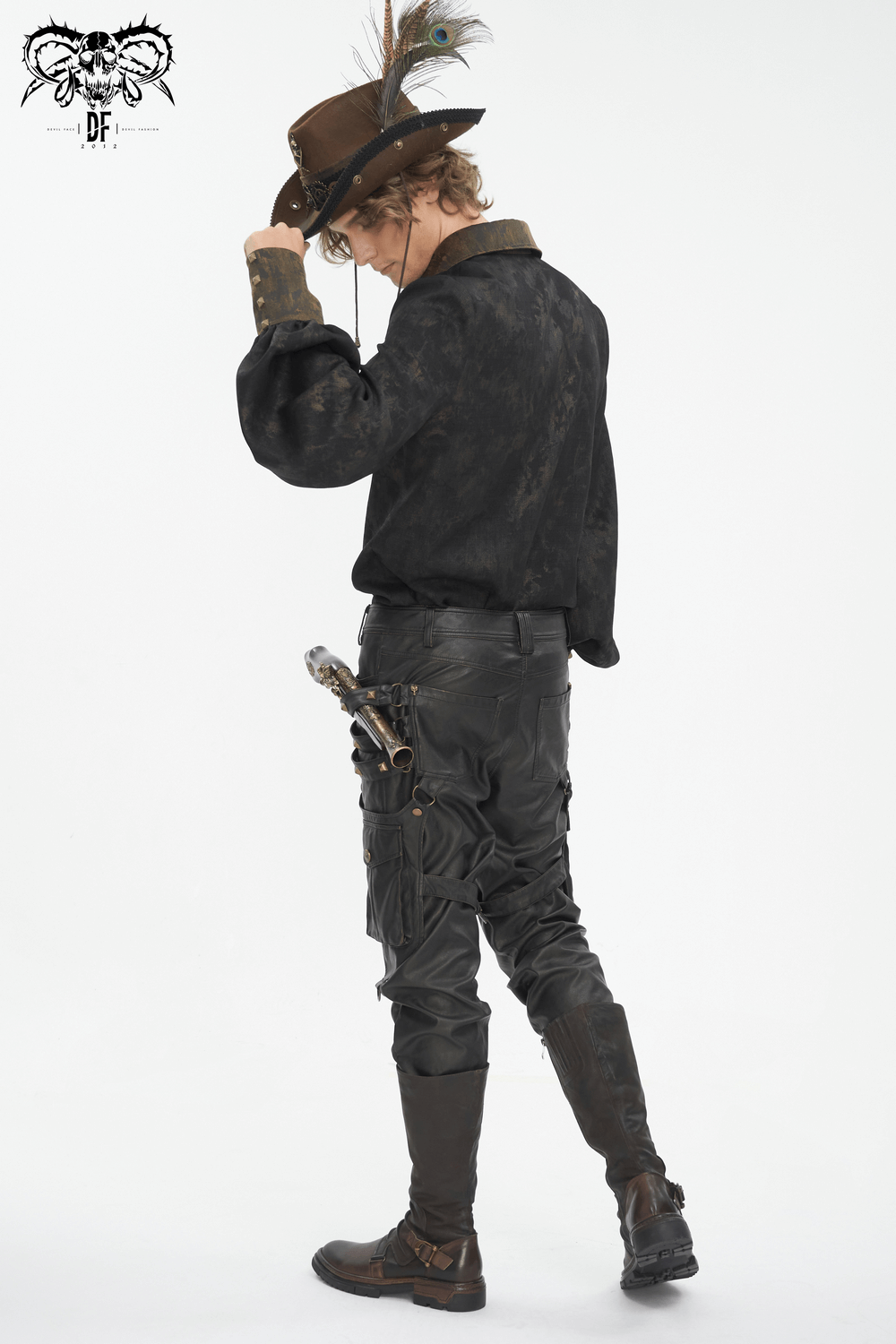Men's Gothic punk outfit featuring faux leather pants, a stylish hat, and a dramatic pose from behind.