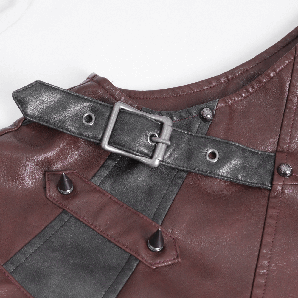 Close-up of men's gothic punk faux leather vest with studs and buckle detail.