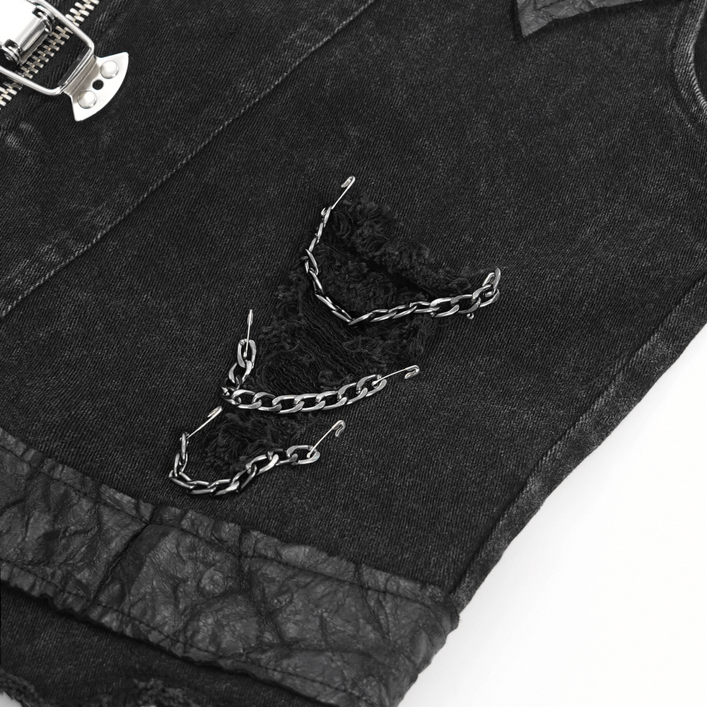 Close-up of edgy men's gothic punk vest featuring frayed denim and chain embellishments. Perfect for concerts and rebellious style.