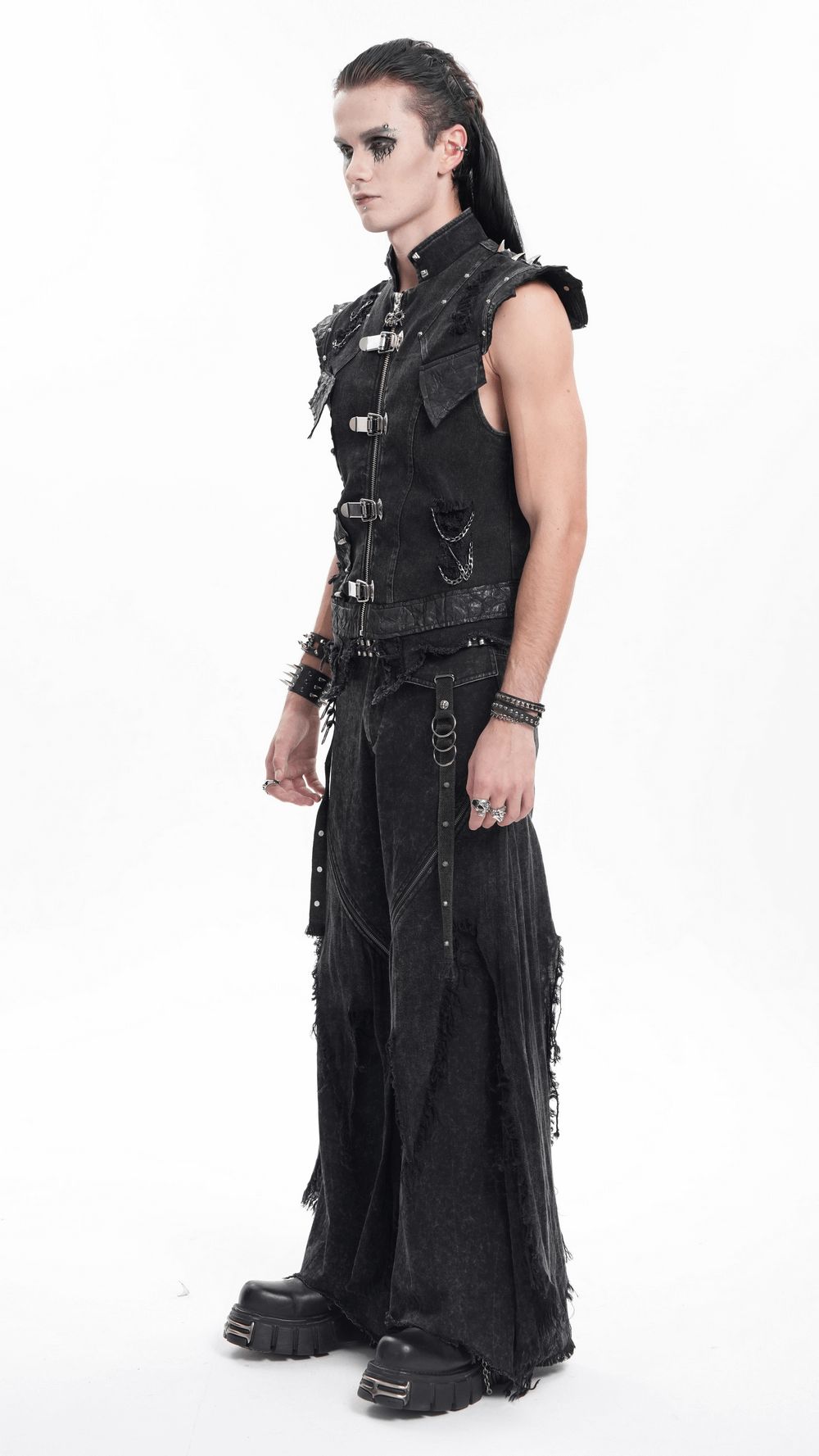 Men's gothic punk denim vest with chains and buckle details, worn with edgy black pants and platform boots.