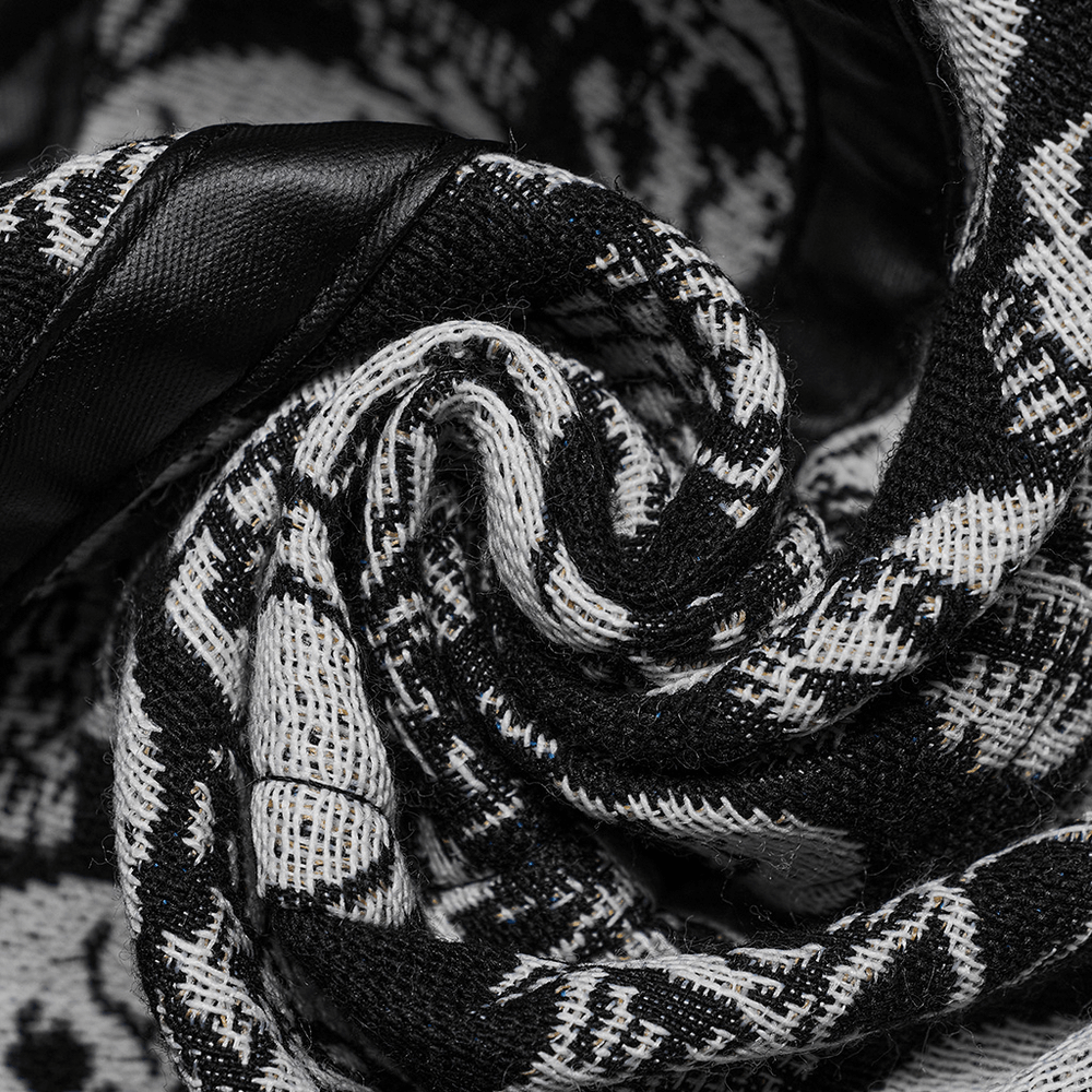 Close-up of Gothic Skull jacquard fabric showcasing intricate black and white skull patterns, perfect for edgy fashion.