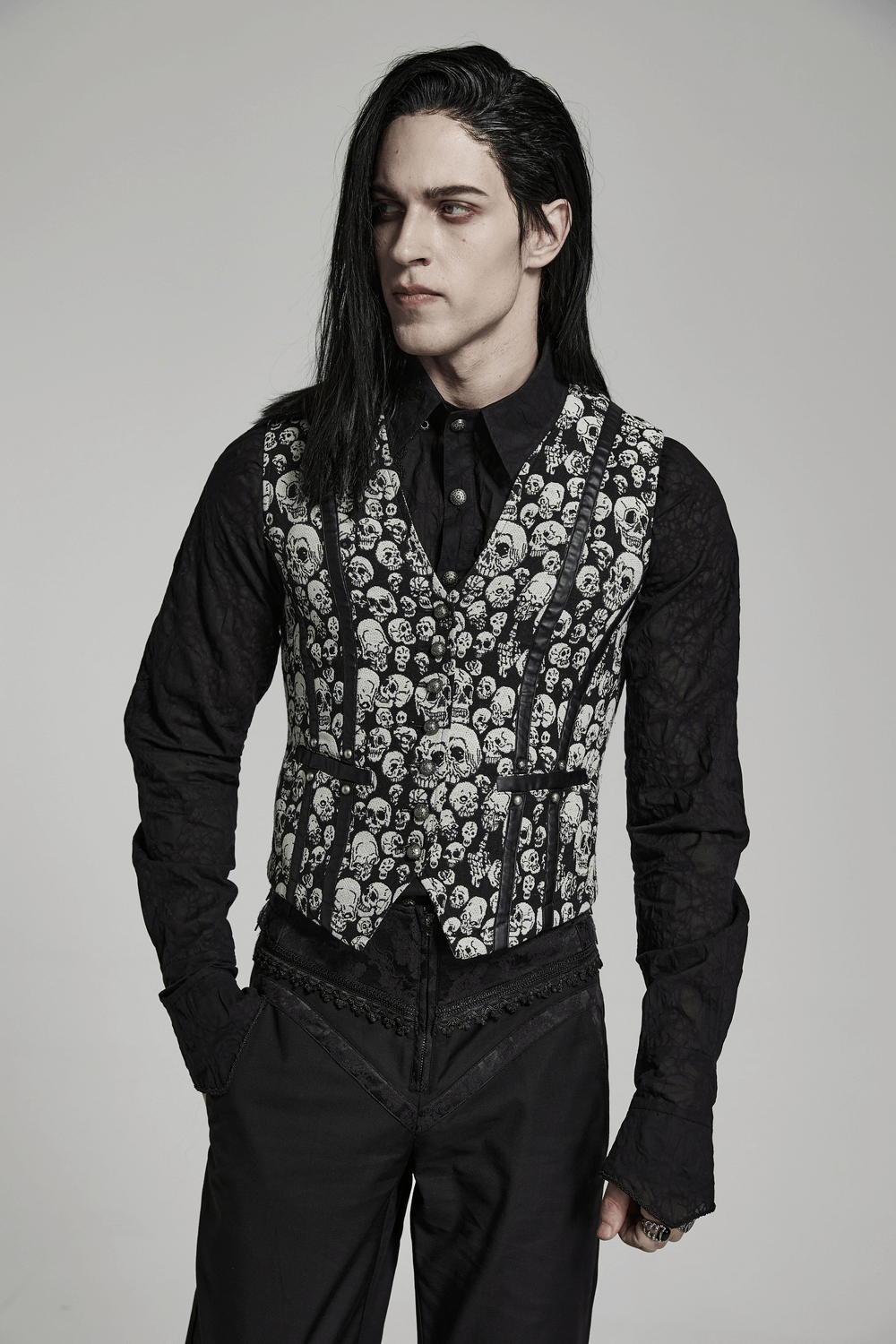 Men's Gothic Skull Jacquard Vest featuring a fitted design and bold skull pattern, styled with a sleek black shirt.