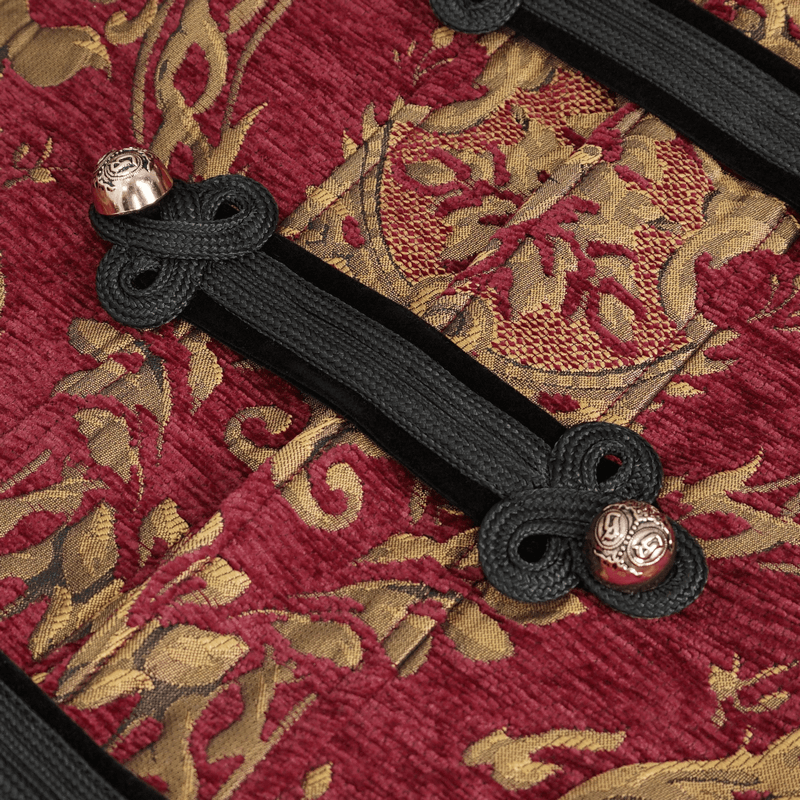Close-up of intricate red and gold fabric details with elegant black fasteners on men's gothic coat.