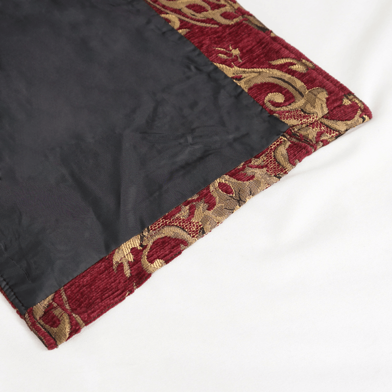 Close-up of the intricate red and gold pattern on the hem of a men's gothic sleeveless coat.