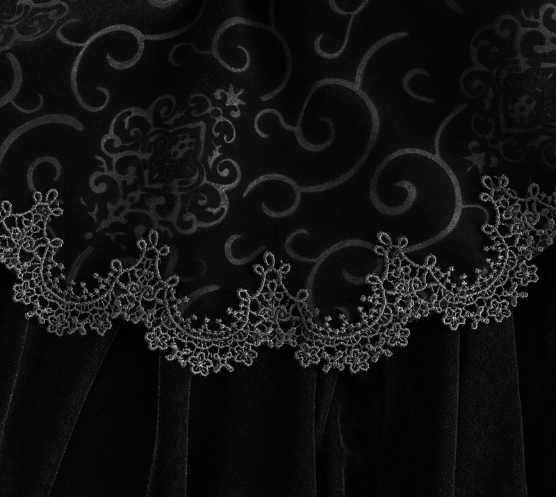 Intricate lace trim on a dark velvet cloak, showcasing gothic elegance and detailed craftsmanship.