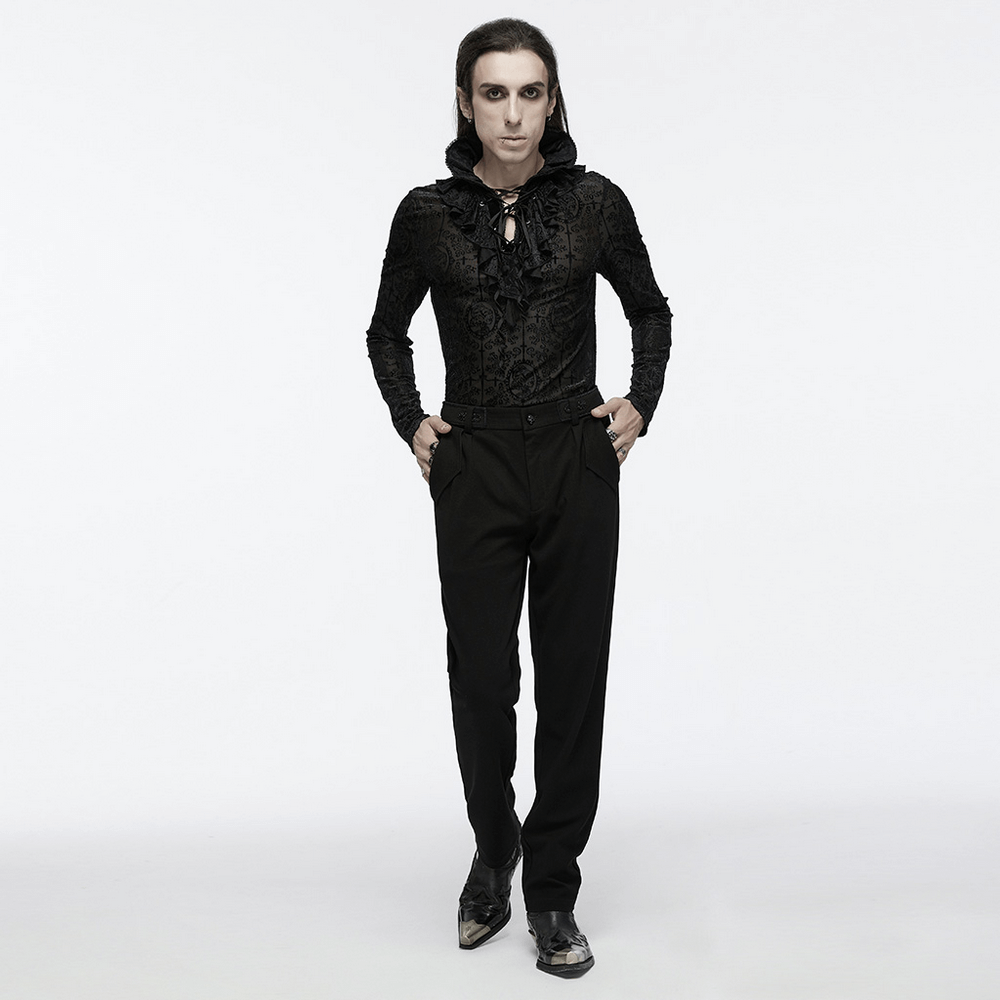 Stylish model showcasing men's gothic straight-leg trousers with retro buckles and a minimalist black hoodie.