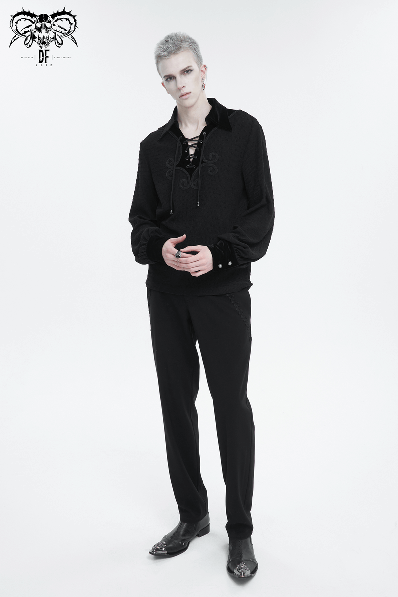 Men's gothic strappy puff-sleeved shirt with lace-up detailing and turn-down collar, styled with dark trousers.