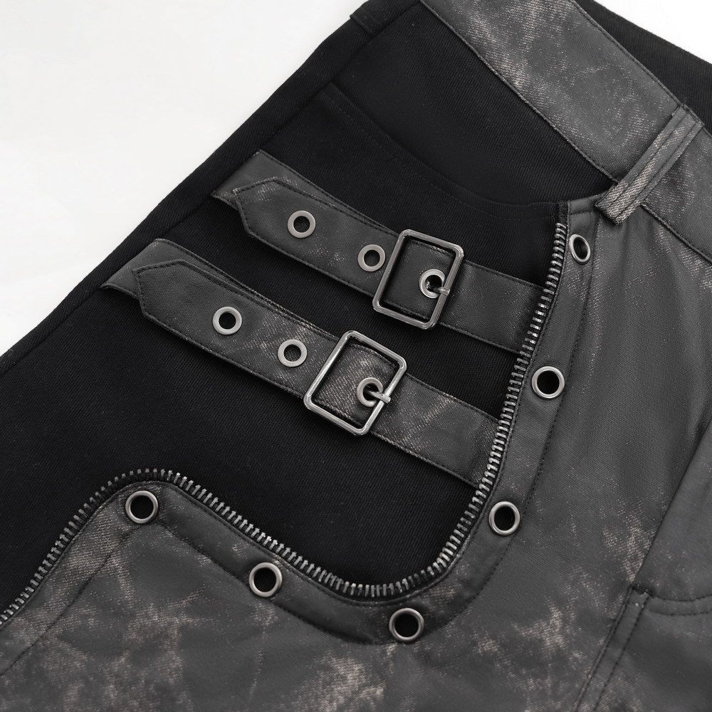 Close-up of men's gothic techwear pants with buckles, faux leather details, and rivet designs for an edgy look.