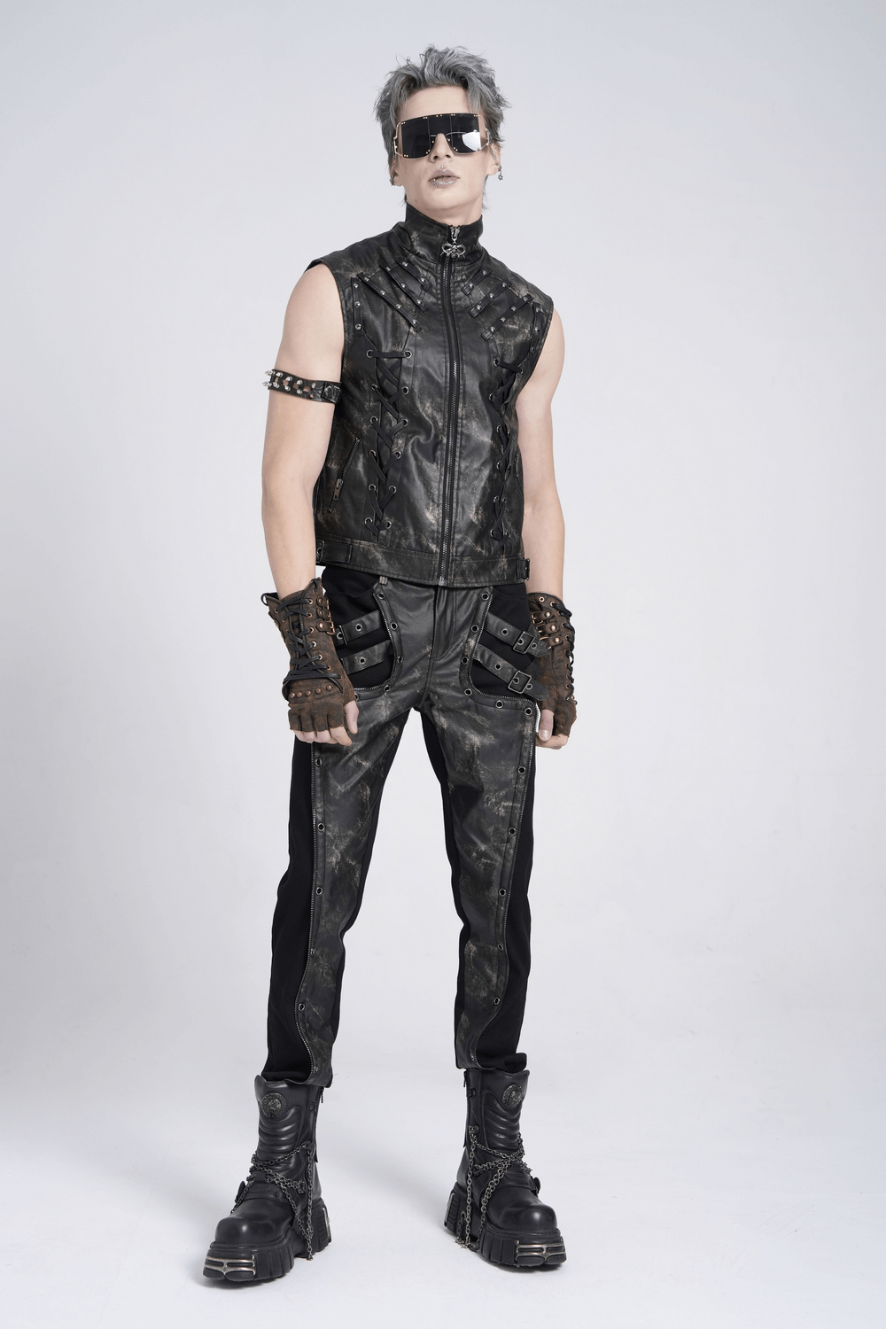 Men's gothic techwear outfit with black faux leather pants, vest, gloves, and sunglasses for a punk style.