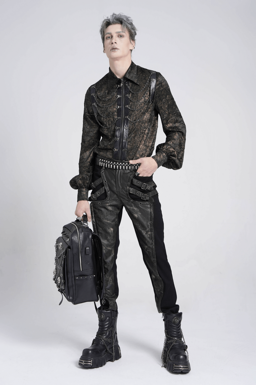 Men's gothic techwear outfit featuring buckled black pants and patterned dark top, ideal for alt fashion enthusiasts.