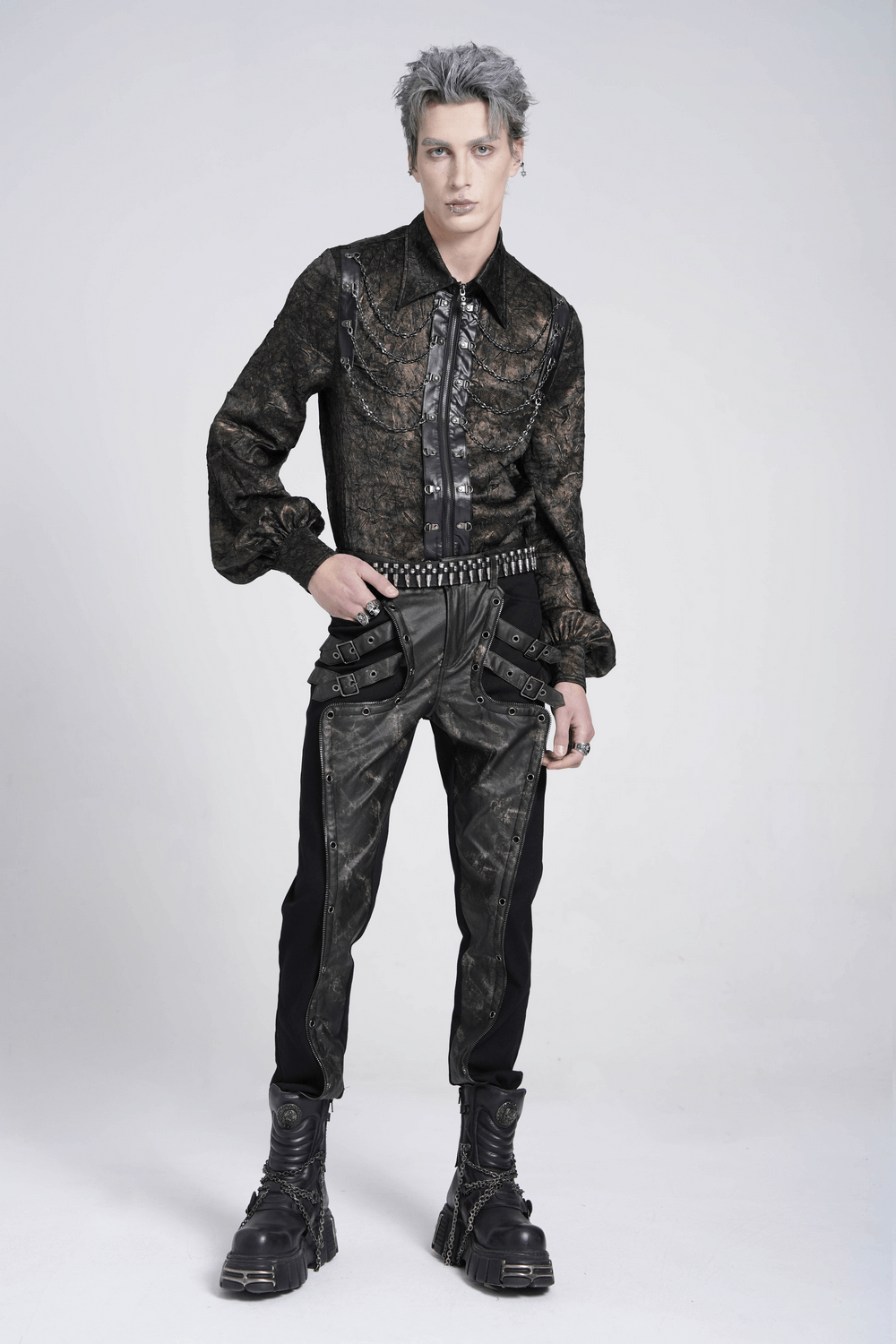 Men's gothic techwear outfit featuring buckled black pants and patterned shirt, perfect for industrial punk style.