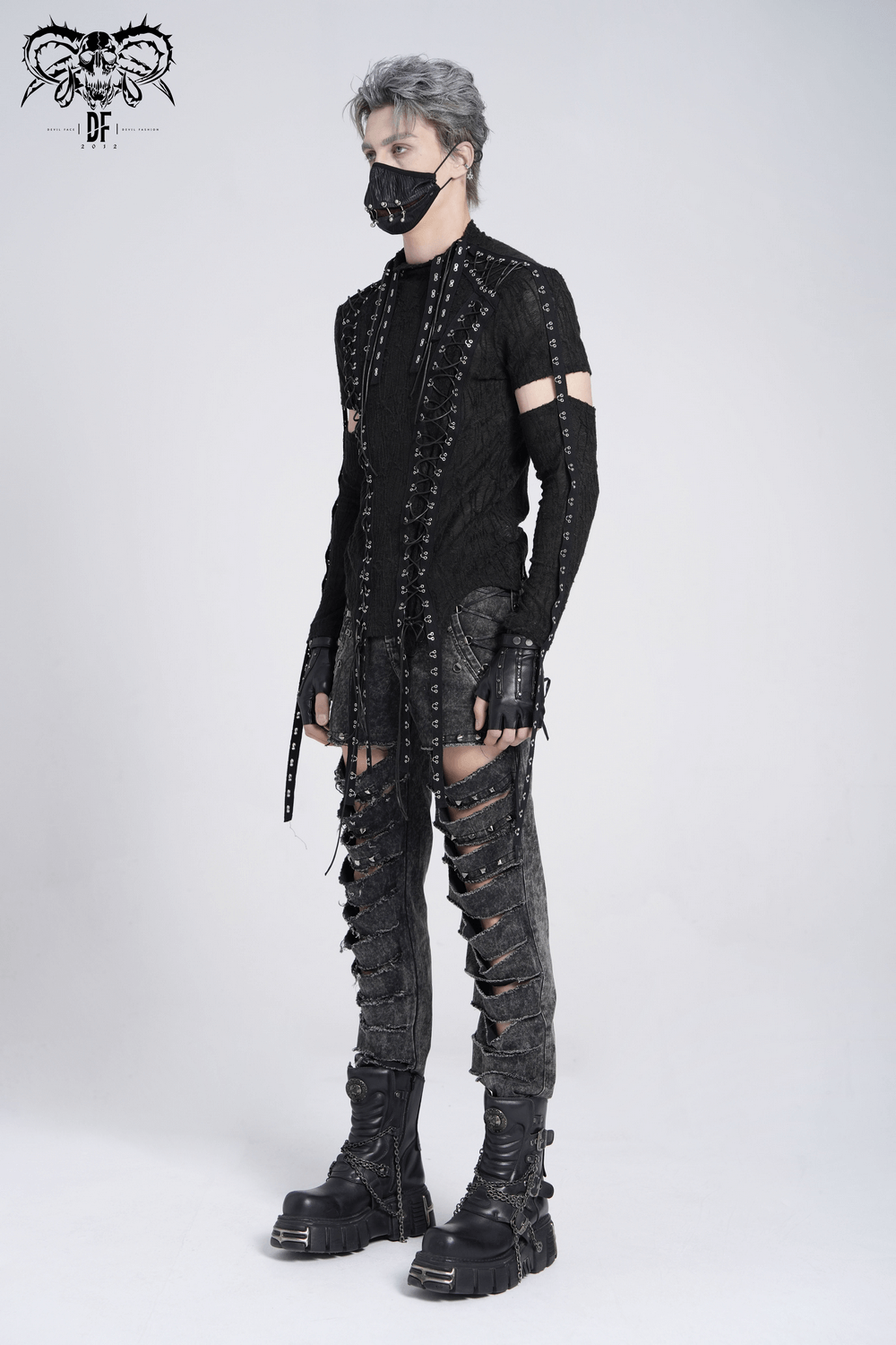 Men's gothic top with cut-out sleeves, lacing detail, and punk-inspired black outfit.