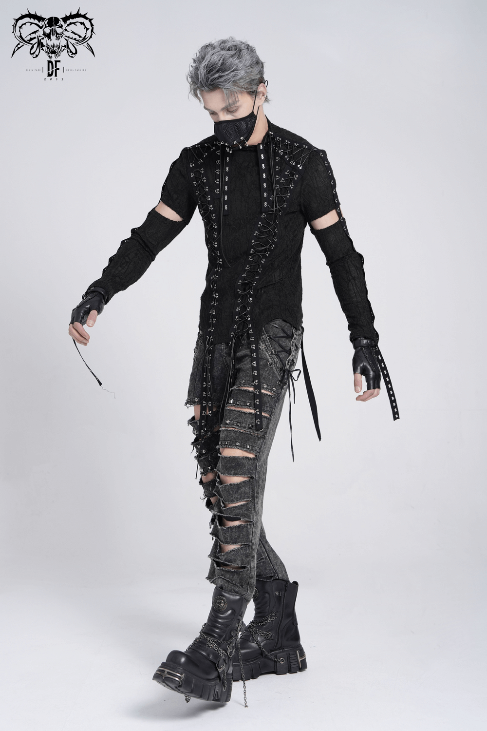 Men's gothic top with cut-out sleeves, lacing details, and distressed pants for punk fashion enthusiasts.