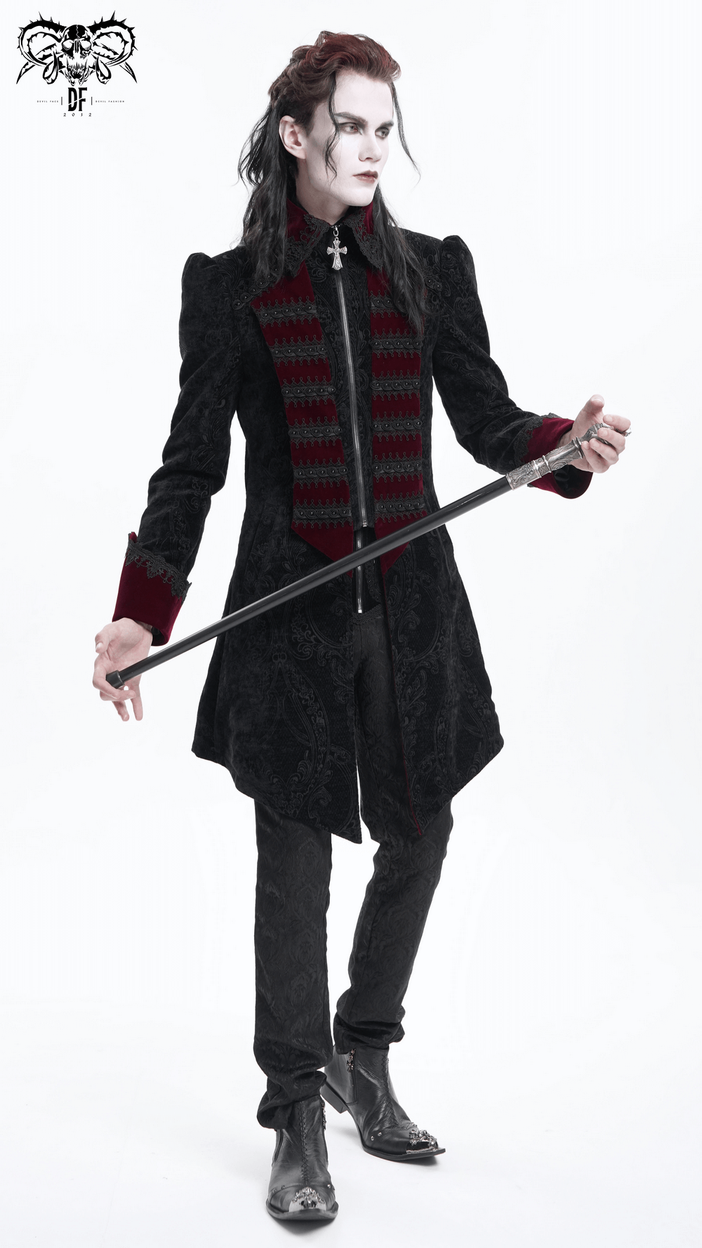 Vintage men's Gothic tailcoat with brocade and velvet details, striking cross design, in wine red and black, stylishly paired with a cane.