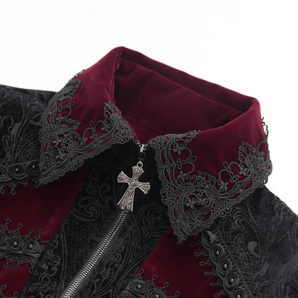 Close-up of wine red velvet collar with intricate lace and silver cross detail on a Gothic men's tailcoat.