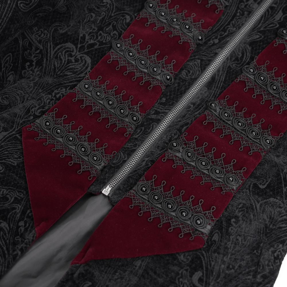 Close-up of men's gothic tailcoat with intricate black brocade and wine red velvet trims featuring striking cross details.