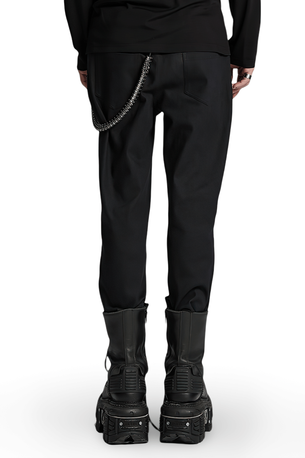 Back view of men's gothic twill pants with PU leather details and a chain accessory, paired with chunky boots.