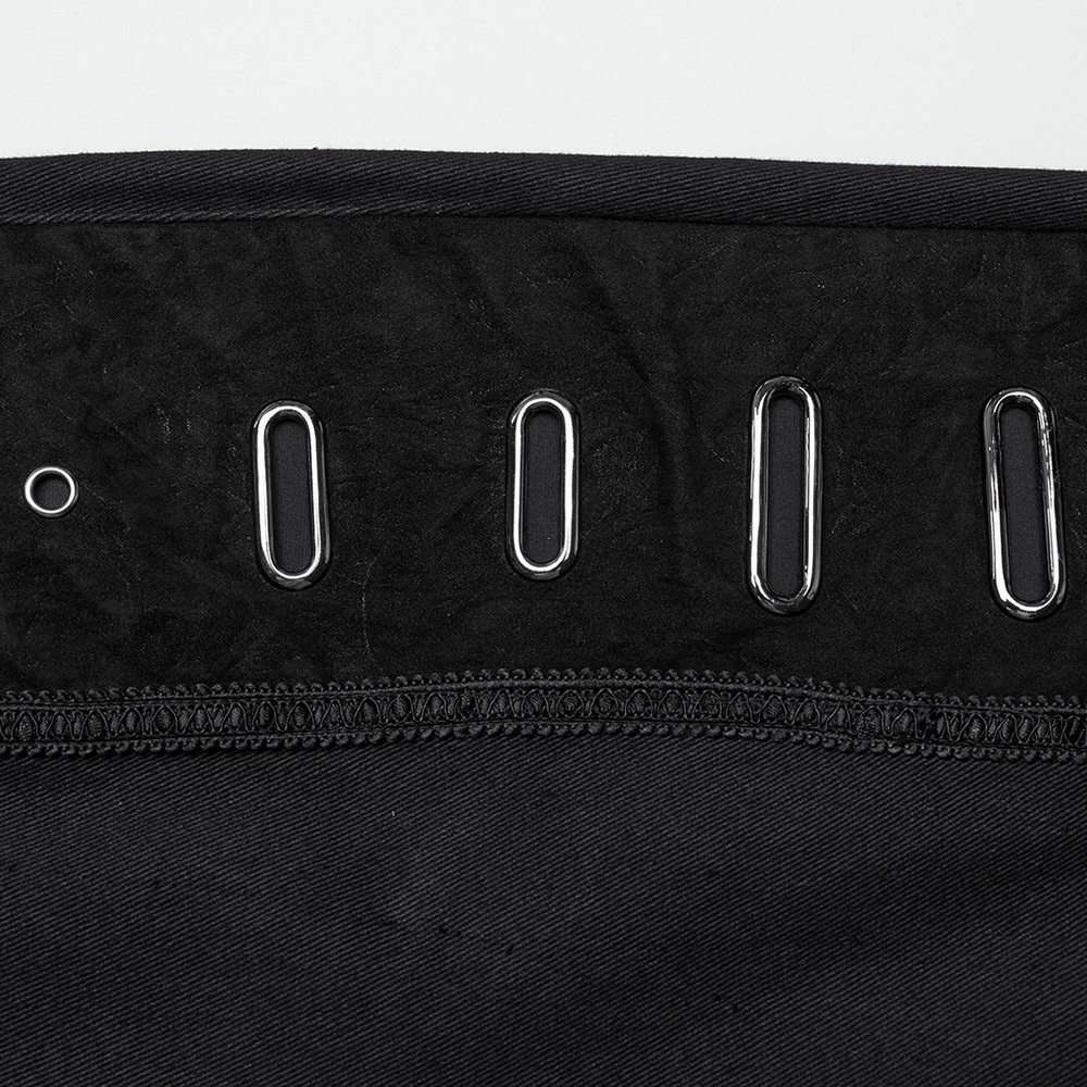 Close-up of eyelet embellishments on men's gothic twill pants, showcasing bold punk-inspired details.