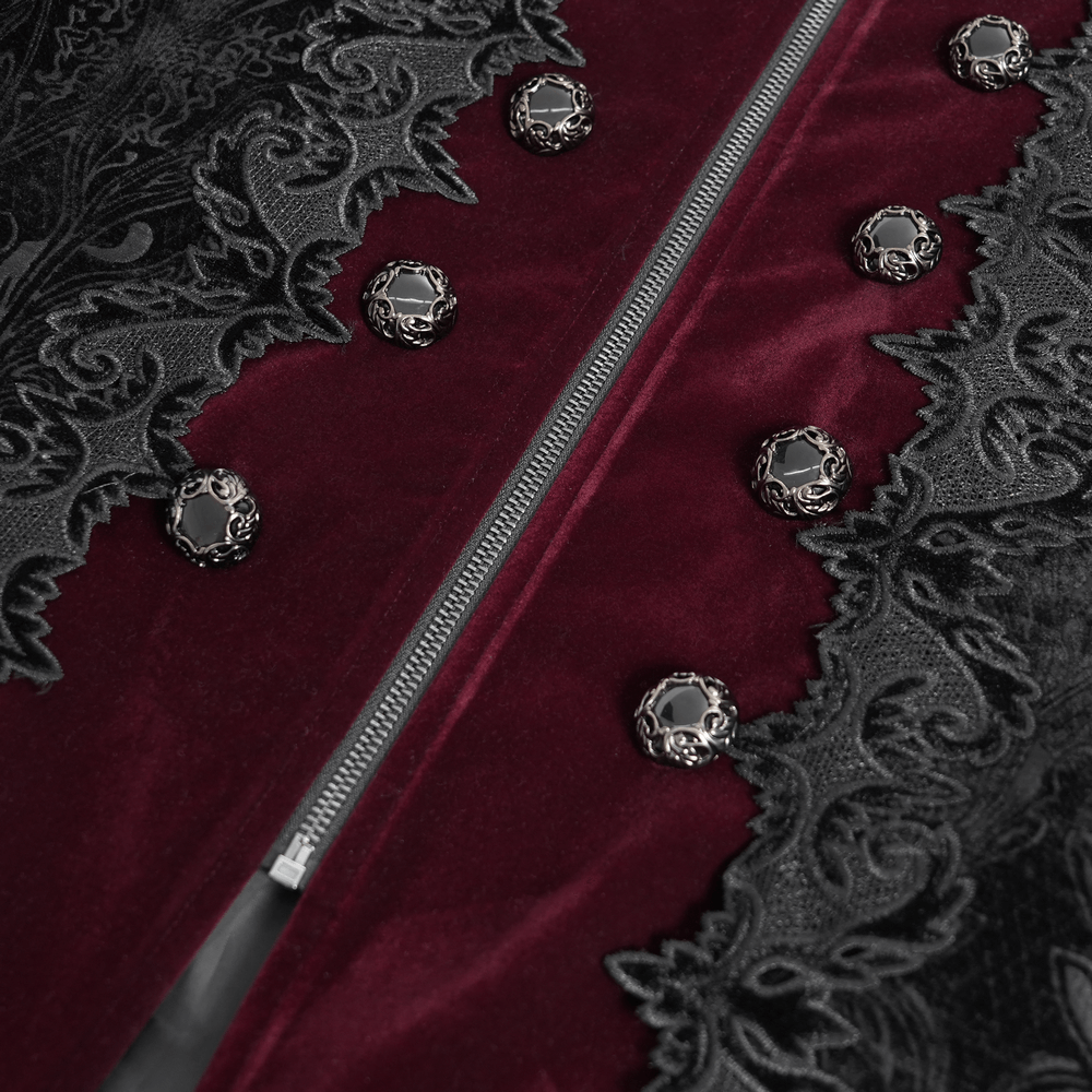 Close-up of men's gothic velvet coat with wine red trim and ornate brocade, featuring silver-tone skull buttons.