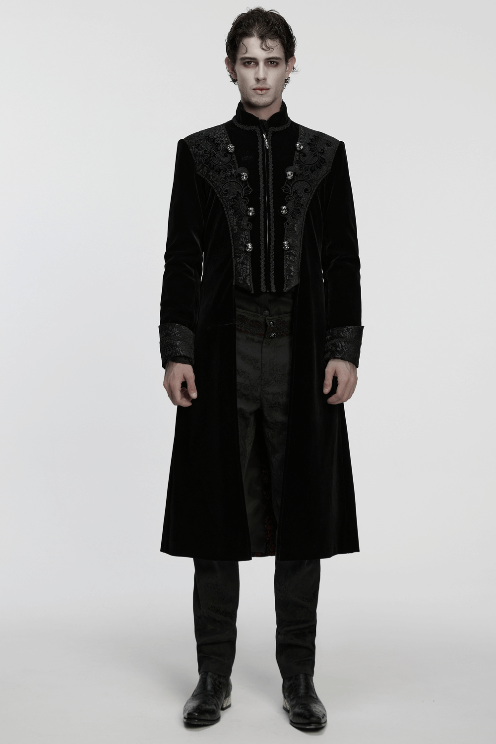 Men's Gothic Velvet Long Coat with Jacquard Detailing worn by a model, showcasing intricate palace embroidery and elegant design.