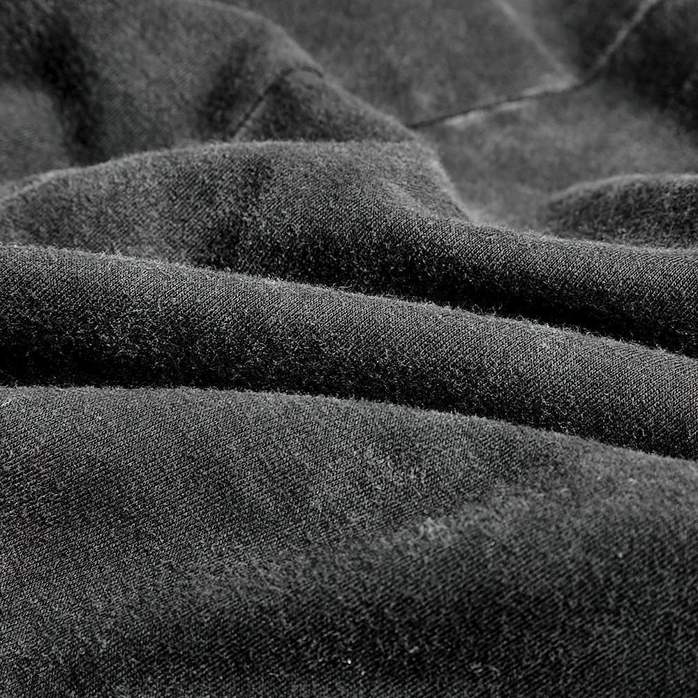 Close-up of soft black cotton fabric, ideal for a gothic vest or punk fashion, showcasing rich texture and depth.