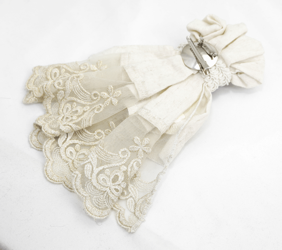 Men's Gothic white cotton tie with vintage lace detailing and a retro brooch for stylish alternative fashion.