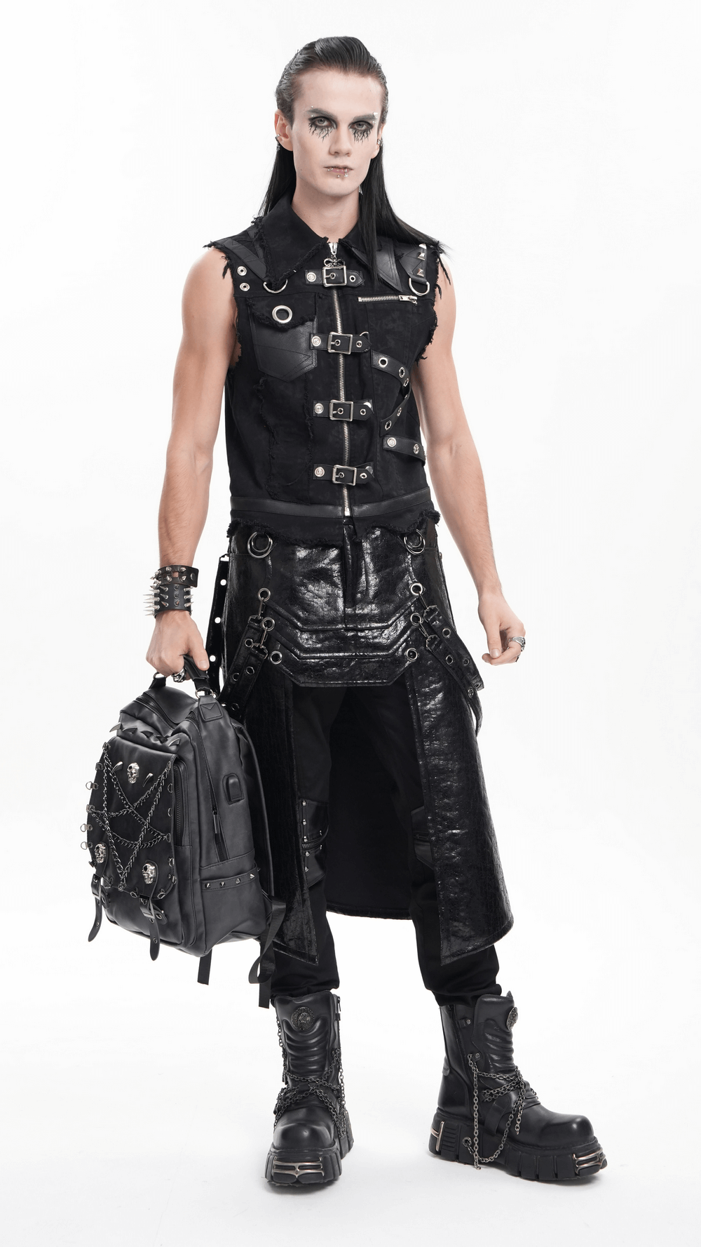 Edgy man in a gothic zipper vest, showcasing punk style with buckles, chains, and a sleek black outfit. Perfect for streetwear.