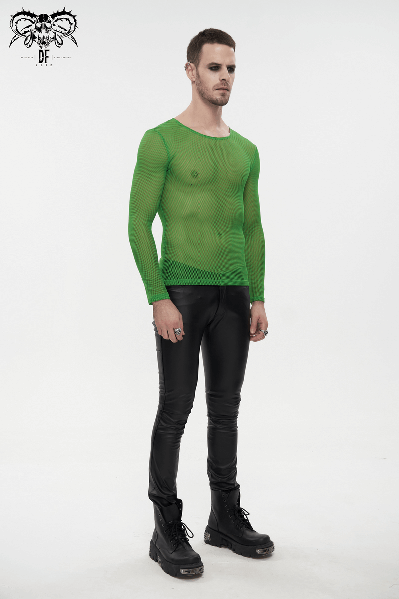 Stylish man in a bright green long sleeve mesh top, paired with black shiny pants, showcasing alternative fashion.