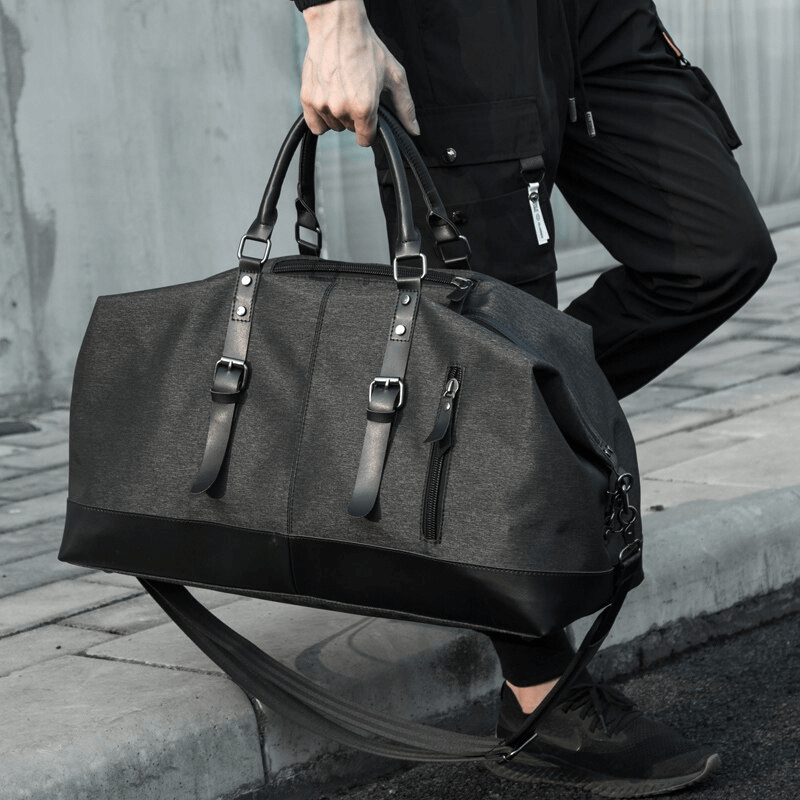 Stylish men's large capacity multifunctional travel duffel bag being carried, ideal for casual travel and organization.