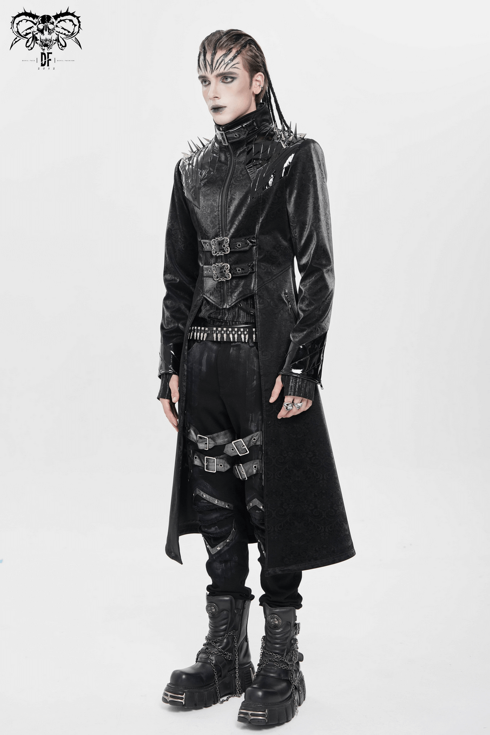 Men's Long Coat with Spikes and Metal Buckle Detail worn by a model in black velvet, showcasing gothic fashion.