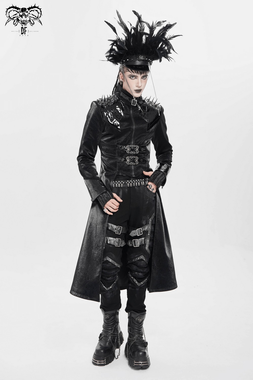 Men's Long Coat with Spikes and Metal Buckle Detail worn with gothic accessories and bold styling.