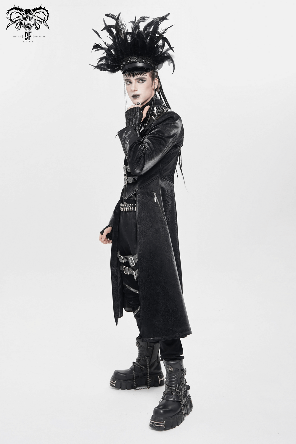 Men's Long Coat with Spikes and Metal Buckle Detail worn in a gothic fashion setting.