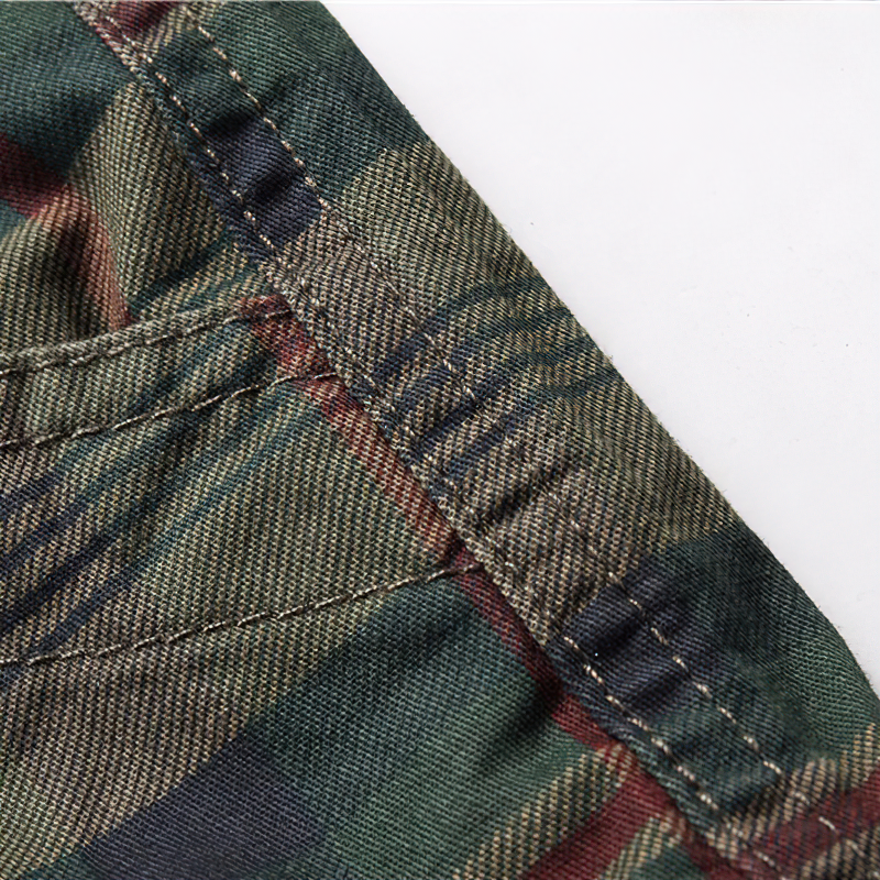 Close-up of the fabric and stitching detail on men's plaid cargo shorts, showcasing quality craftsmanship.