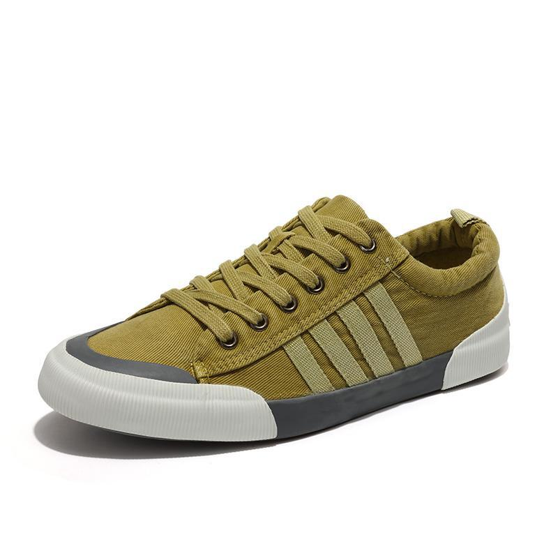 Rock style breathable casual sneakers for men in olive green color with lace-up design and round toe.